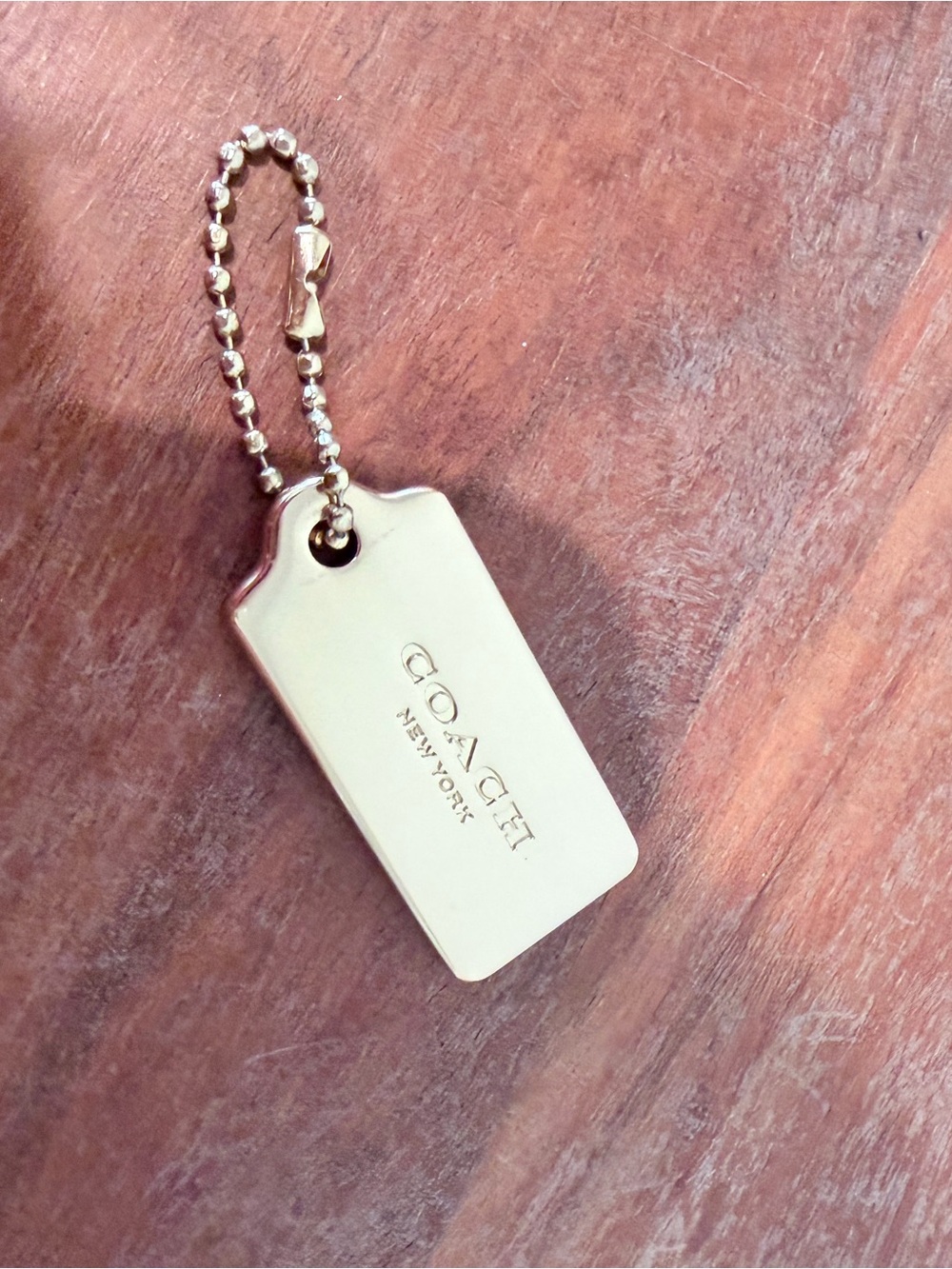 Coach Gold-Tone Logo Hangtag